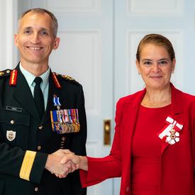The Governor General shakes hands with Brigadier-General Cadieu.