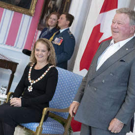 The Governor General looks on as William Shatner is invested into the Order of Canada. 