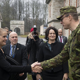 The Governor General shakes hands with NATO CCDCOE member.