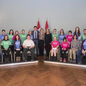 The Prime Minister, the Governor General and David Saint-Jacques`s wife, Véronique Morin, take a group photo with the youth in attendance. 