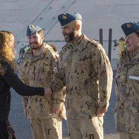 Governor General Julie Payette shakes hands with a Canadian Armed Forces member. 