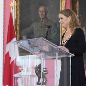 Governor General Julie Payette stand at a podium and delivers a speech.