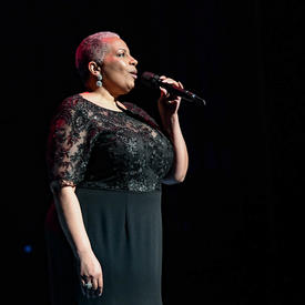 A singer is performing on stage. 