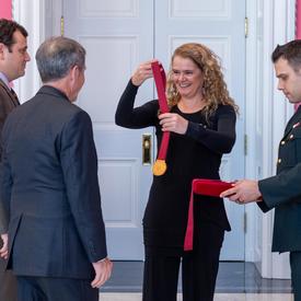 The Governor General gives medals to David Brian and Stephen Punga. 