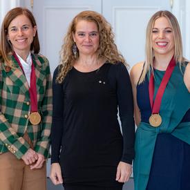 Kayla Dallyn and Genevieve Soler pose for a photo with the Governor General. 