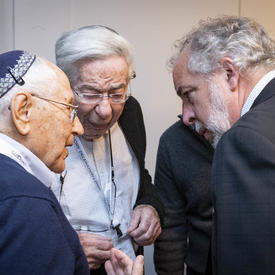 Canadian Member of Parliament, Rhéal Éloi Fortin, chats with Holocaust survivors. 