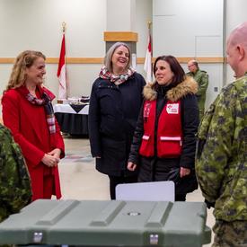 The Governor General discusses with staff at CFB Trenton.