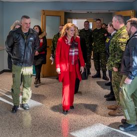The Governor General discusses with staff at CFB Trenton.