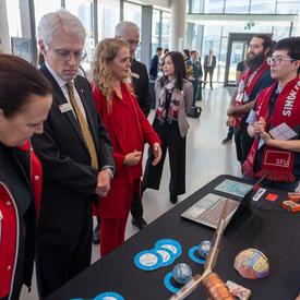 The Governor General meets with students from Simon Fraser University and hears about their projects.