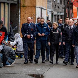 The Governor General walks with first responders in Vancouver.
