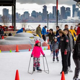 The Governor General skates with members of the community. 