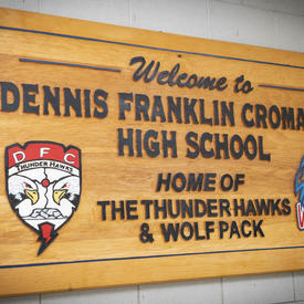 A photo of a Dennis Franklin Cromarty High School wooden sign.