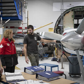 The Governor General in the Aviation Centre of Excellence hangar with students, teachers and aircraft.