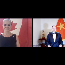 A computer screen split in two shows a woman on the left, standing in front of a Canadian flag. On the right, a man wearing a suit and bow tie is sitting in front of the flag of Vietnam.