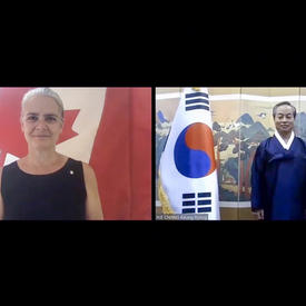 A computer screen split in two shows a woman, on the left, standing and smiling in front of a Canadian flag. On the right, a man is standing next to the flag of Korea.