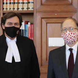 Administrator Wagner and Ian Shugart standing next to each other. Both wearing masks.