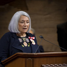 Mary May Simon speaking at the podium in the Senate Chamber. 