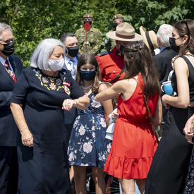 Governor General Mary May Simon greeting family and friends outside Rideau Hall.