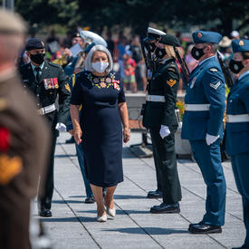 Governor General Mary May Simon walking away from the War Memorial.