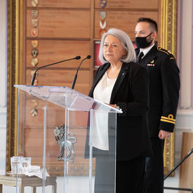 The Governor General speaks at a podium in the Tent Room.