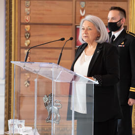 The Governor General speaks at a podium in the Tent Room.