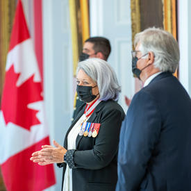 Governor General Mary May Simon and His Excellency Whit Fraser stand together during part of the ceremony.Governor General Mary May Simon and His Excellency Whit Fraser standing during part of the ceremony.