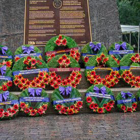 Several wreaths at the base of the National Aboriginal Veterans Monument.
