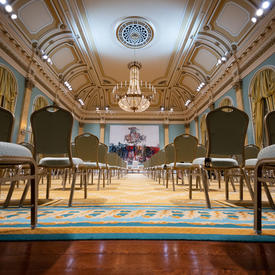 The Ballroom at Rideau Hall. There is no one in the room. The photo is taken at the back of the ballroom facing the front. 