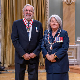 Yanick Villedieu is standing next to the Governor General.