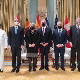 Their Excellencies stand with the new heads of mission.