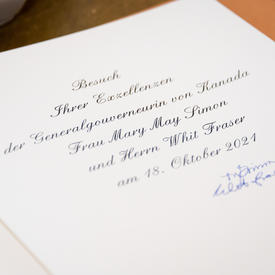 A photo of Their Excellencies signatures in a guest book.