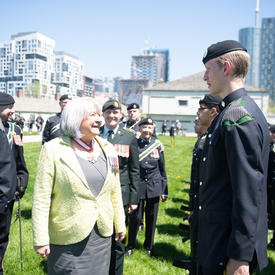 The Governor General is greeting a member of the Queen’s York Rangers.