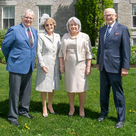 Their Excellencies are posing for a picture with Her Royal Highness Princess Margriet of the Netherlands and Professor Pieter van Vollenhoven outside of Rideau Hall.