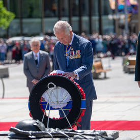 His Royal Highness is placing a wreath at the National War Memorial.