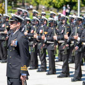 Governor General Simon is inspecting a guard of honour.