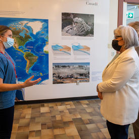 Governor General Simon is listening to one of the staff from the Institutes of Ocean Sciences. 