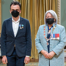 Grégory Sadetsky standing next to the governor general.