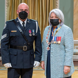 Sergeant Michael Fonseca standing next to the governor general.