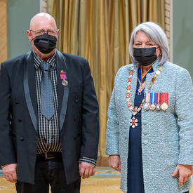 Pierre Lessard standing next to the governor general.