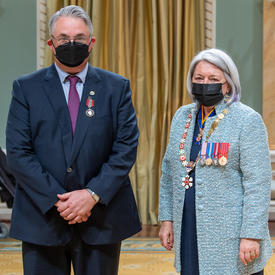 Dominique Bellemare standing next to the governor general.