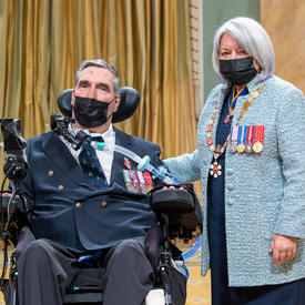 Colonel Gregory Hug next to the governor general.