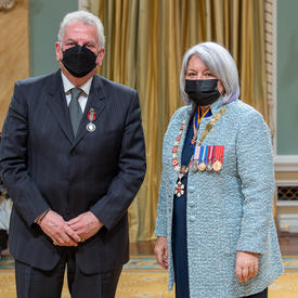 Joel King standing next to the governor general.