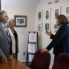 Their Excellencies are standing in an office with Angélique Bernard, Commissioner of the Yukon.