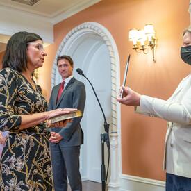 Minister Filomena Tassi is reading an oath.