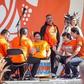 A group of performers are on stage.