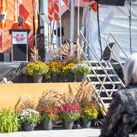 View of the stage. A man is speaking at a podium.
