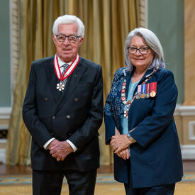 Jean-Charles Coutu is standing next to the Governor General.