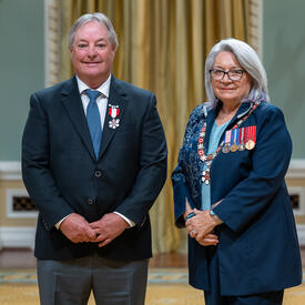W. J. Brad Bennett is standing next to the Governor General.