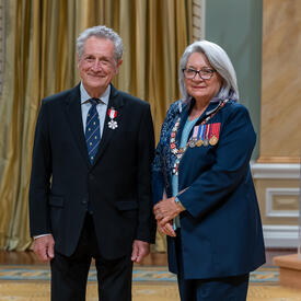 Ronald Ivan Cohen is standing next to the Governor General.