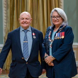 Charles Edgar Fipke is standing next to the Governor General.